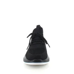 Sorte strikkede slip on sko med en fast kant i åbningen.